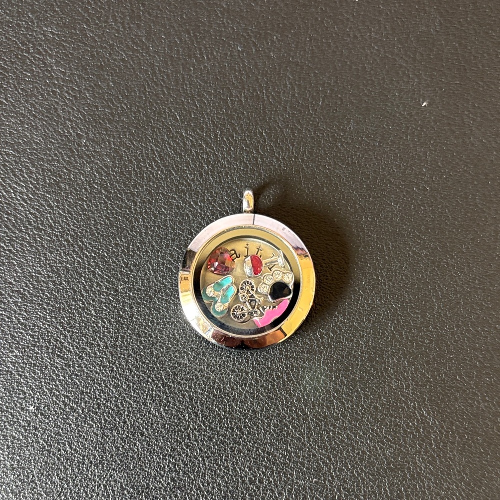 Origami Owl Silver Locket with Colorful Charms.